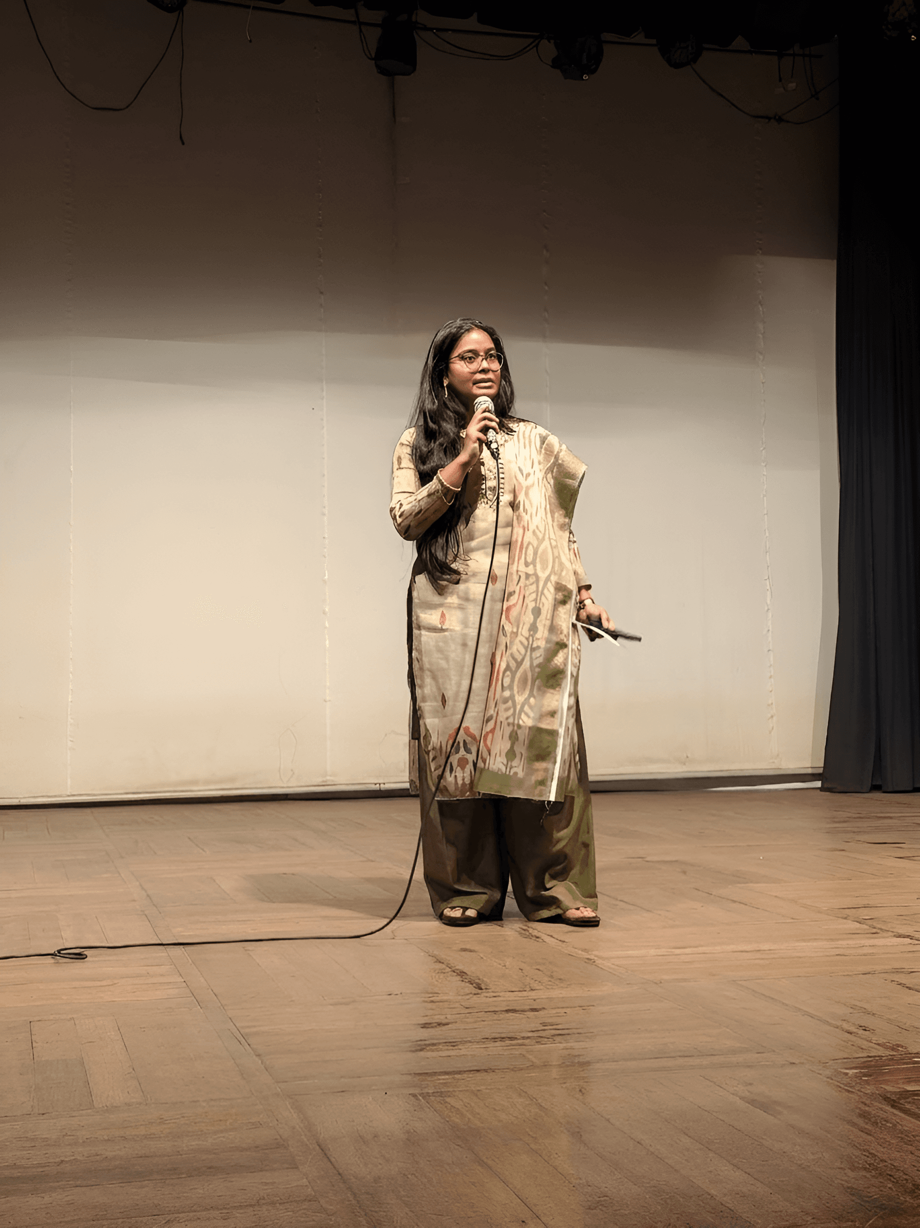 AI Image Enhancer: Sharpen Speaker on Stage Photo