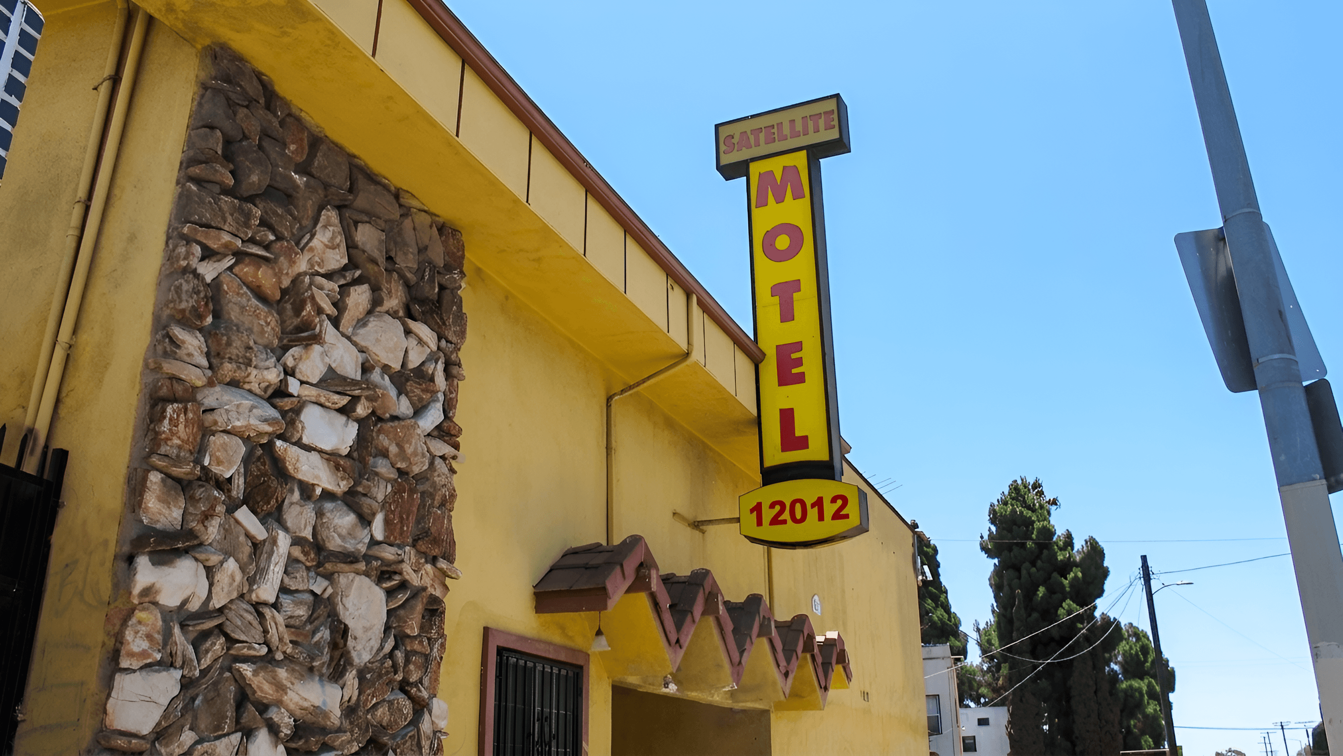 Upscale Satellite Motel Sign Photo | AI Image Enhancer